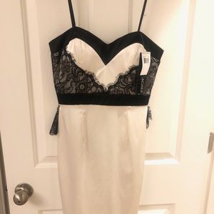 Betsy & Adam white dress with black lace accents